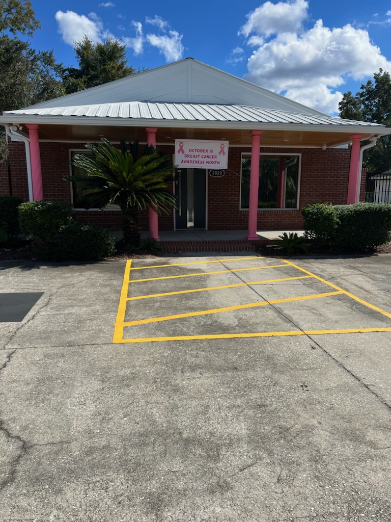 Hoffman Law Firm paints columns pink for Breast Cancer Awareness month in October